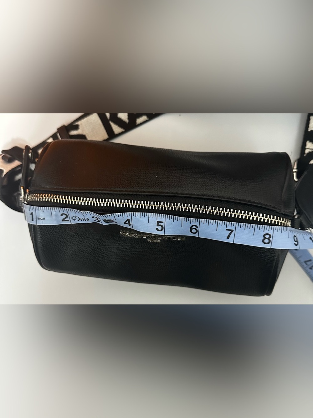 Karl Lagerfeld Paris Black Pebbled Barrel Crossbody Bag with Logo Guitar Strap - Picture 10 of 13